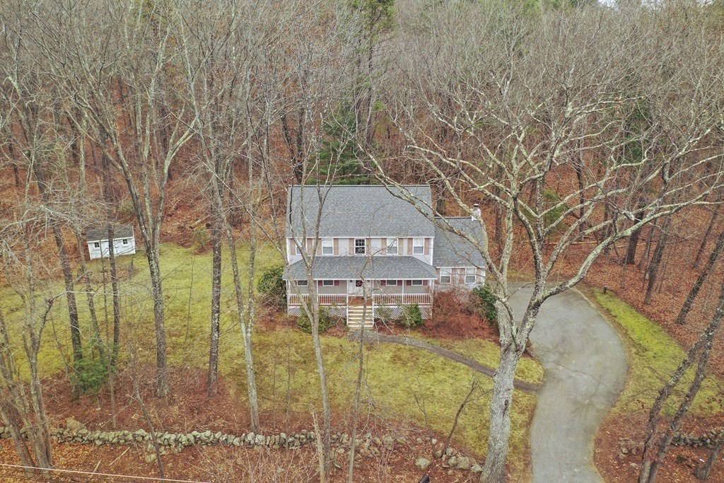 47 Scribner Road Tyngsboro, MA 01879 - Photo 30 of 38 a view of a building with a yard