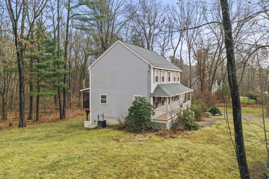 47 Scribner Road Tyngsboro, MA 01879 - Photo 35 of 38 a view of a house with backyard and tree