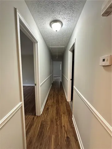 a view of entryway with wooden floor