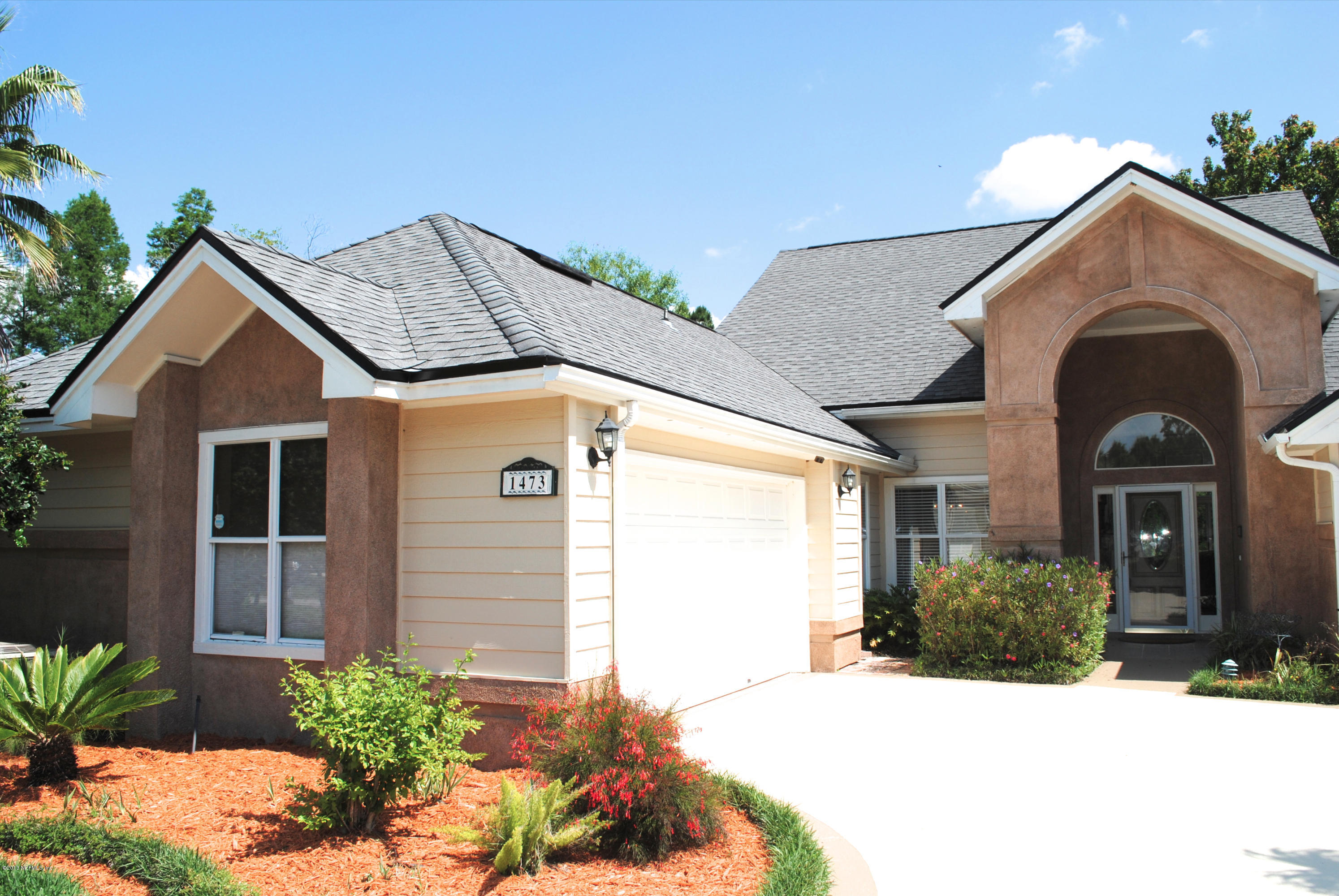 1473 Marsh Rabbit Way Fleming Island, FL 32003 - Photo 2 of 35 Courtyard Entry Garage