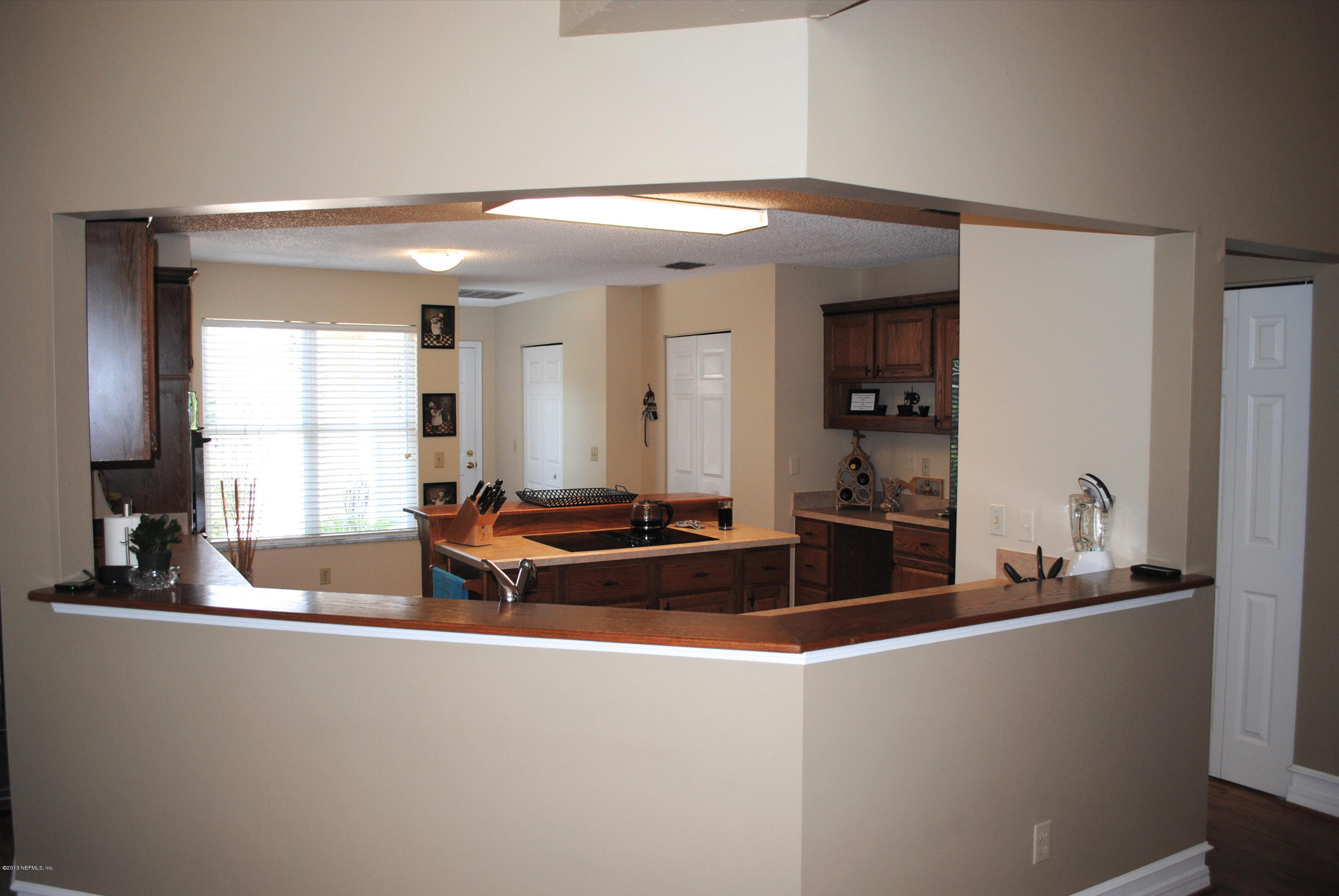 1473 Marsh Rabbit Way Fleming Island, FL 32003 - Photo 9 of 35 Great Room to breakfast bar
