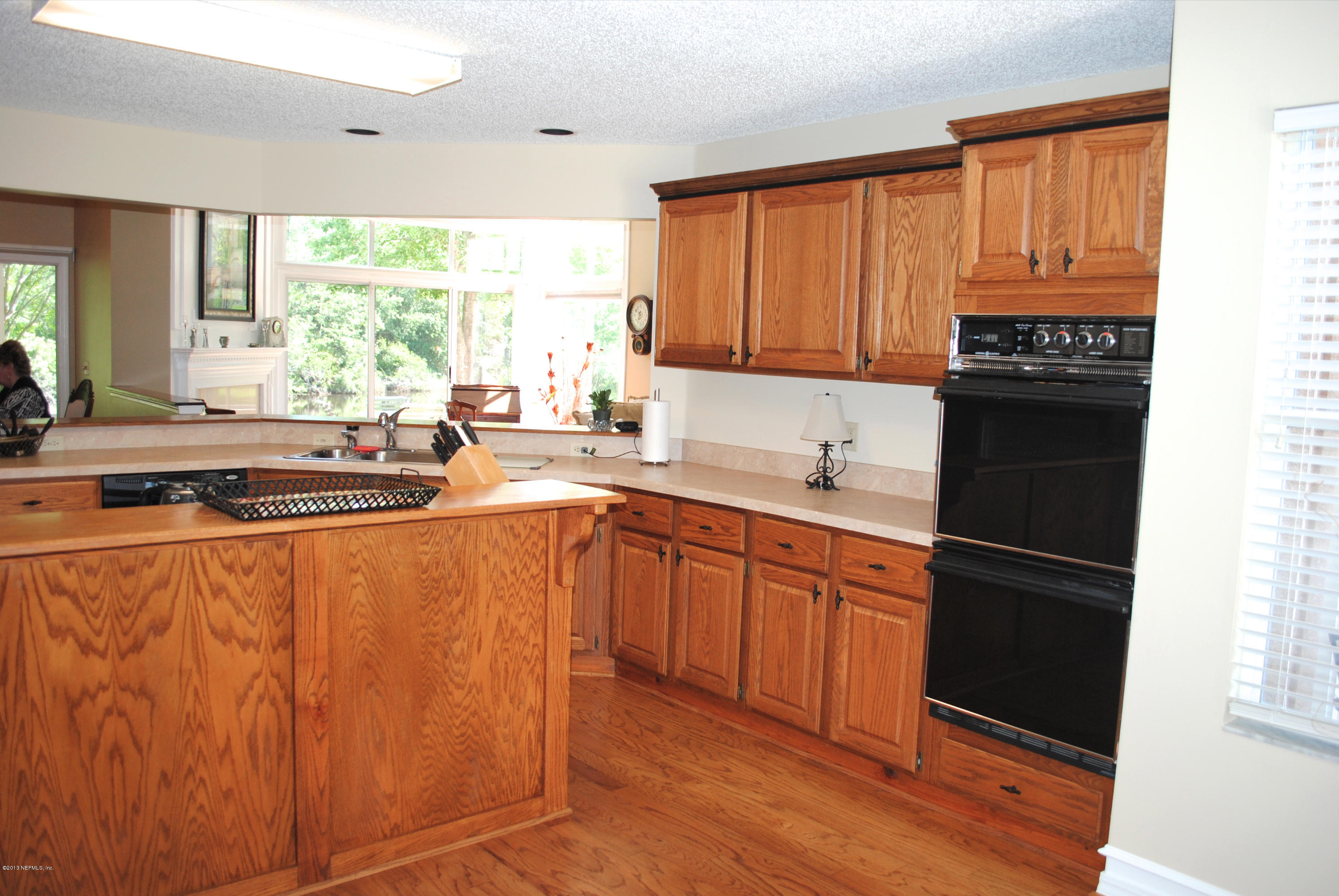 1473 Marsh Rabbit Way Fleming Island, FL 32003 - Photo 10 of 35 Kitchen to Great Room