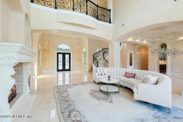 a en suite bathroom with a granite countertop sink and a mirror