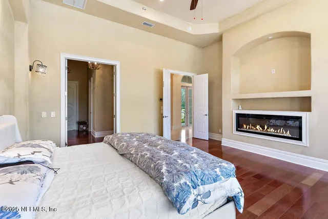 a kitchen with stainless steel appliances granite countertop a stove a sink dishwasher and cabinets with wooden floor