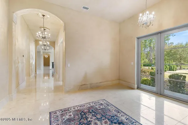 a bathroom with a granite countertop sink a toilet a mirror and shower