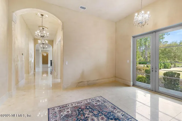 a bathroom with a granite countertop sink a toilet a mirror and shower