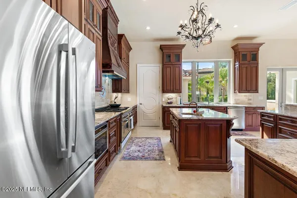 a bedroom with a large bed and a large window