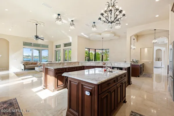 a bathroom with a bathtub a double vanity sink and shower