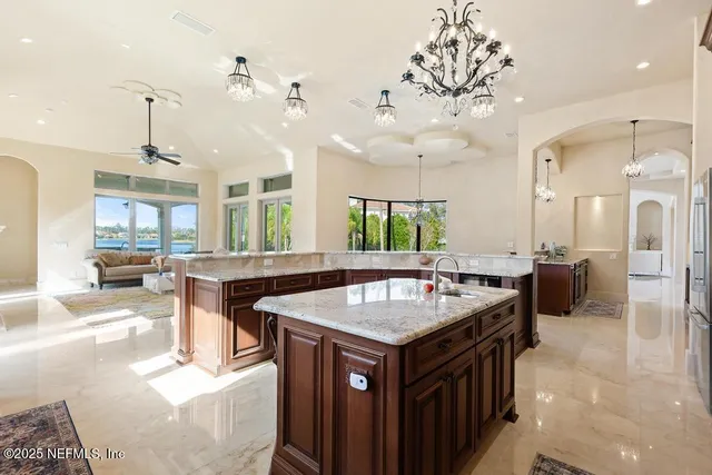 a bathroom with a bathtub a double vanity sink and shower