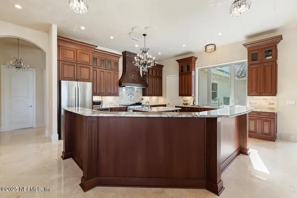 a living room with furniture and a ceiling fan