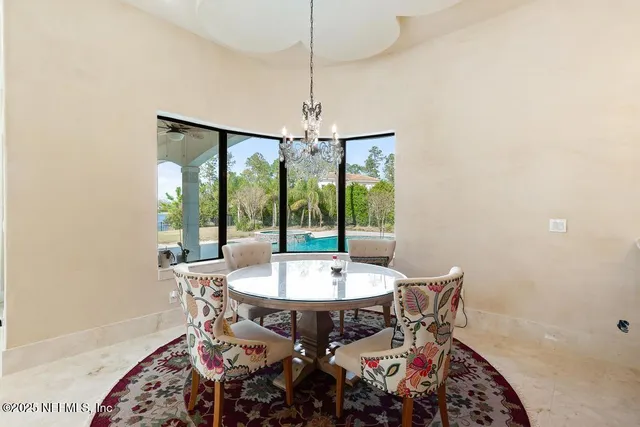 a view of a swimming pool and an outdoor seating