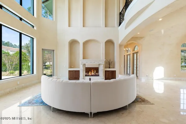 a spacious bedroom with a large bed and a fireplace