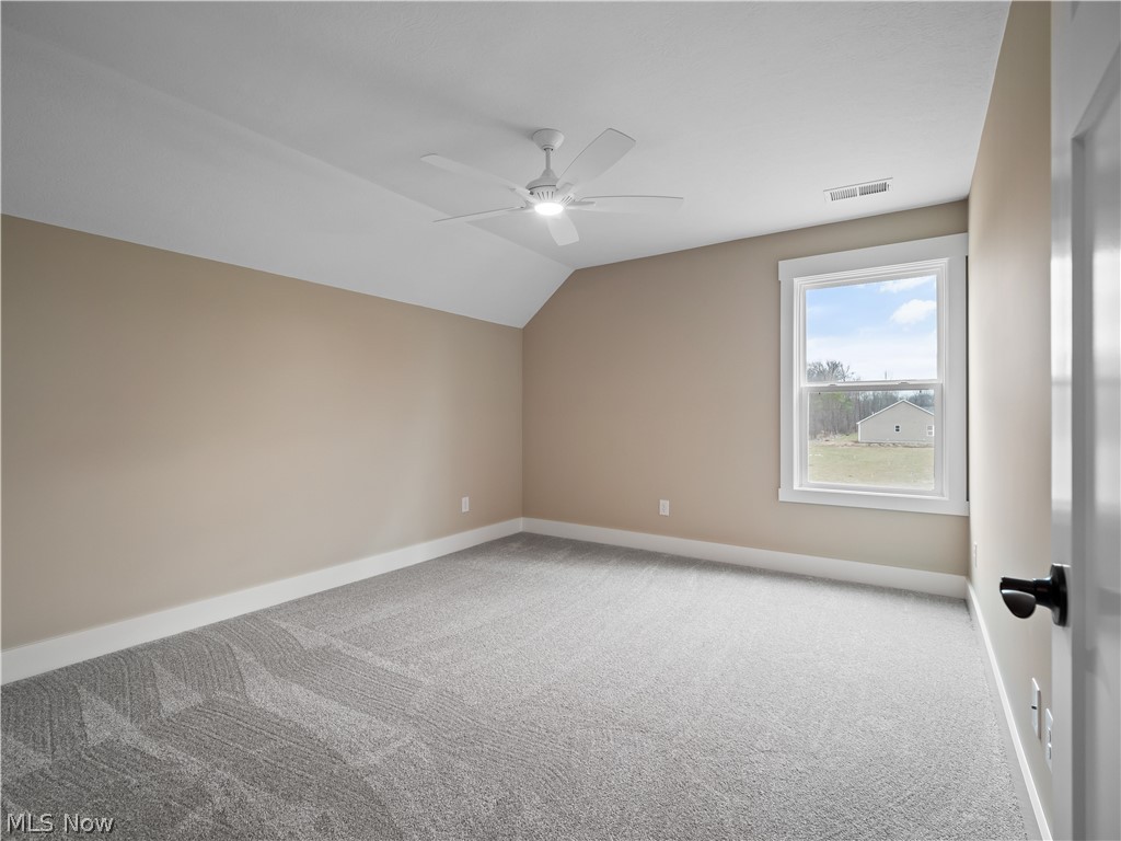 34270 Brookside Lane North Ridgeville, OH 44039 - Photo 38 of 50 Additional living space with vaulted ceiling, light colored carpet, and a ceiling fan