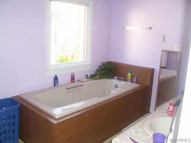 1900 Hawk Town Road Maidens, VA 23102 - Photo 6 of 7 a bathroom with a bathtub and a sink