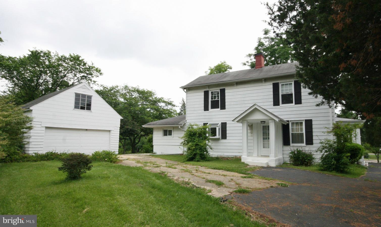 4406 Maple Road Morningside, MD 20746 - Photo 1 of 19 a front view of a house with a garden