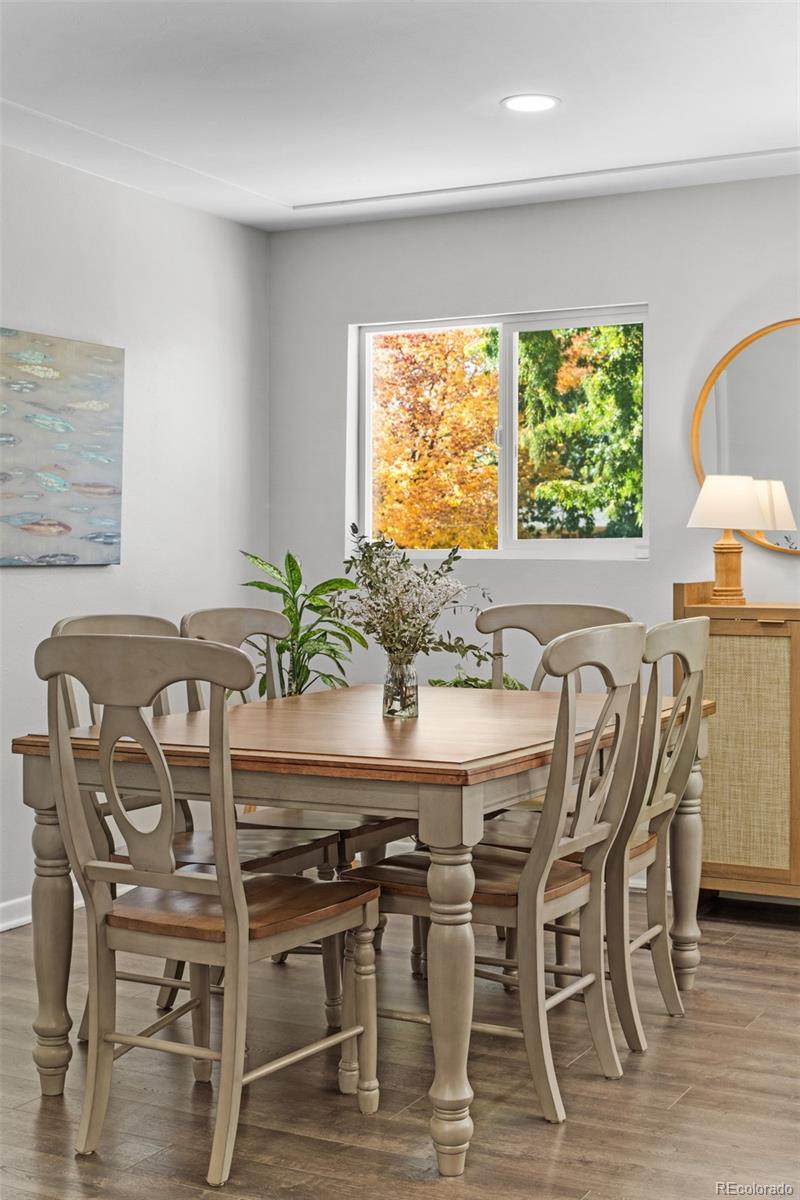 6000 Garrison Street Arvada, CO 80004 - Photo 11 of 50 a view of a dining room with furniture window and wooden floor
