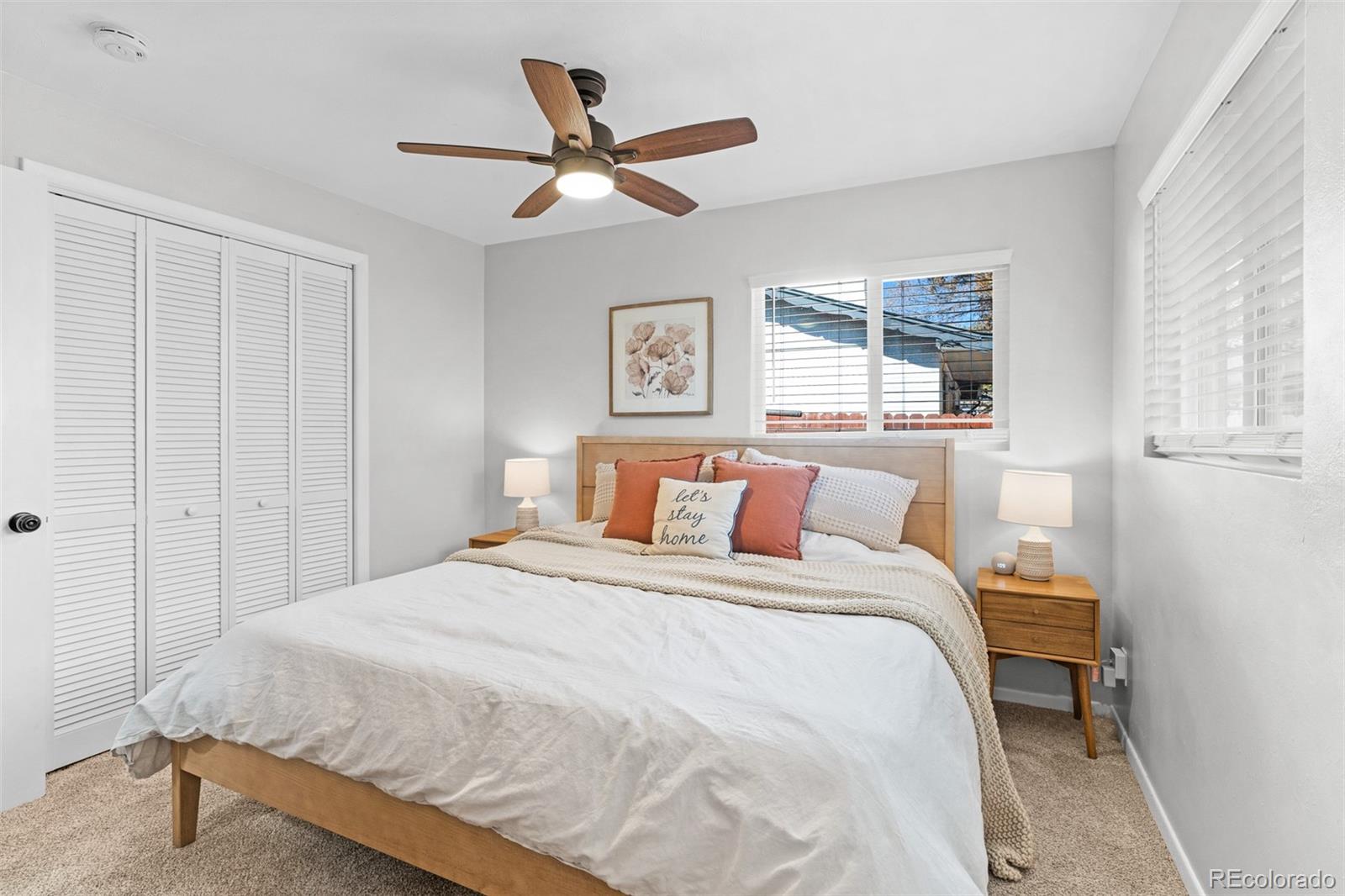 6000 Garrison Street Arvada, CO 80004 - Photo 18 of 50 a bedroom with a bed and a window