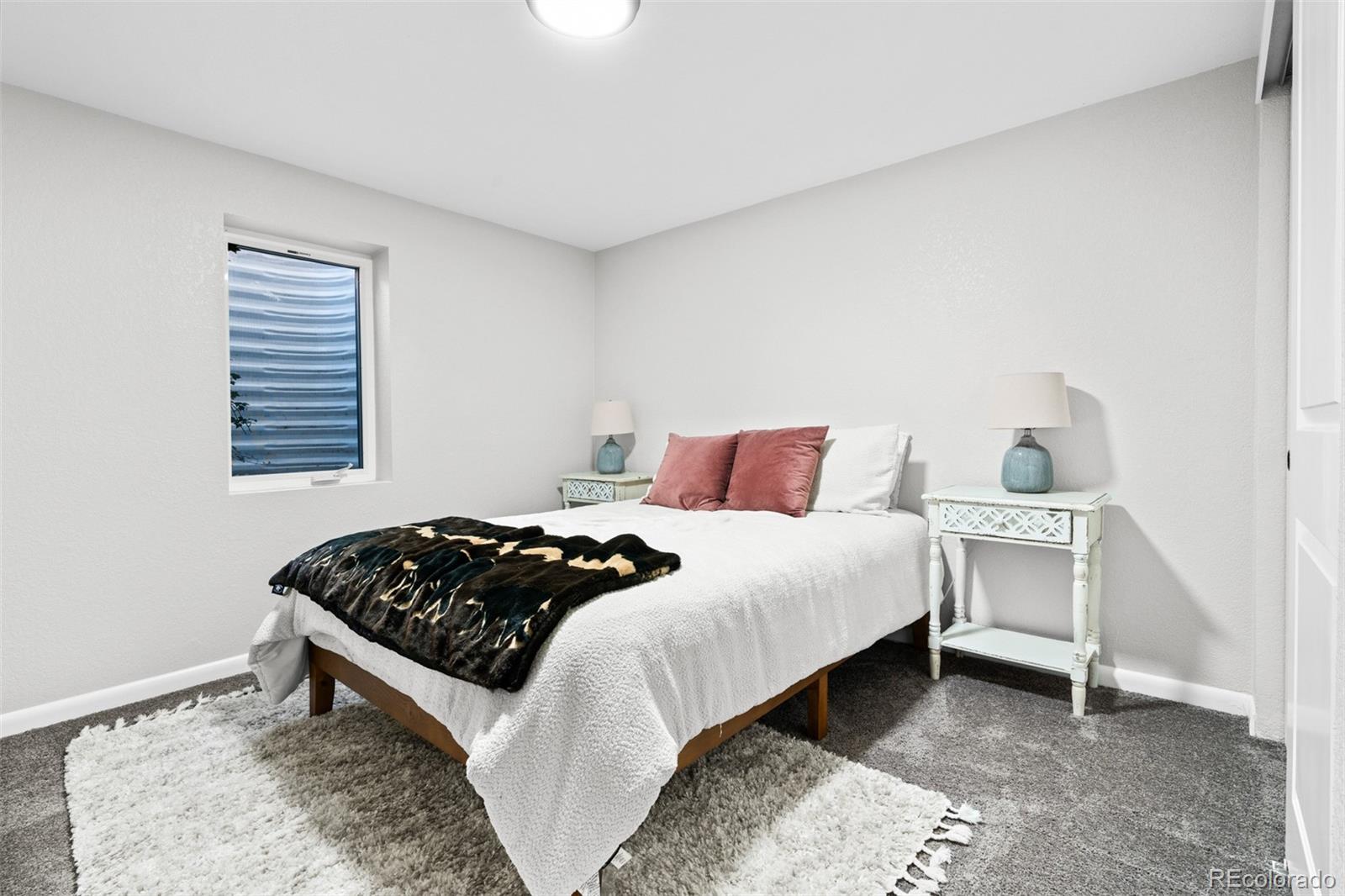 6000 Garrison Street Arvada, CO 80004 - Photo 26 of 50 a bedroom with a bed and a window