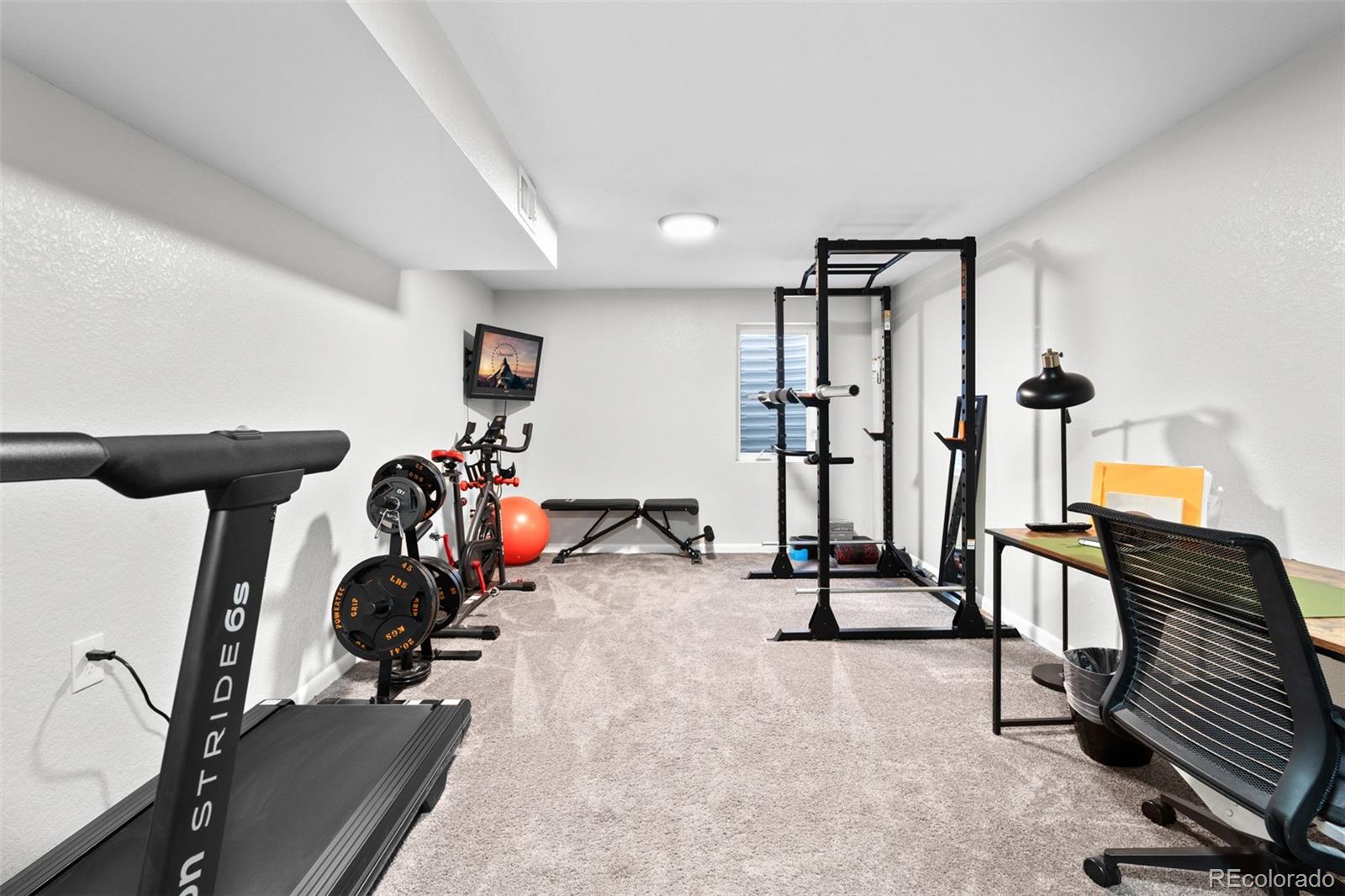 6000 Garrison Street Arvada, CO 80004 - Photo 28 of 50 a view of a room with gym equipment