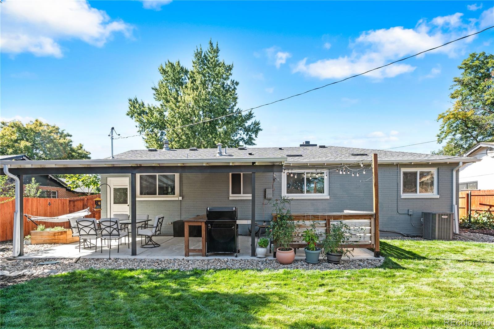 6000 Garrison Street Arvada, CO 80004 - Photo 31 of 50 a view of a house with furniture and garden