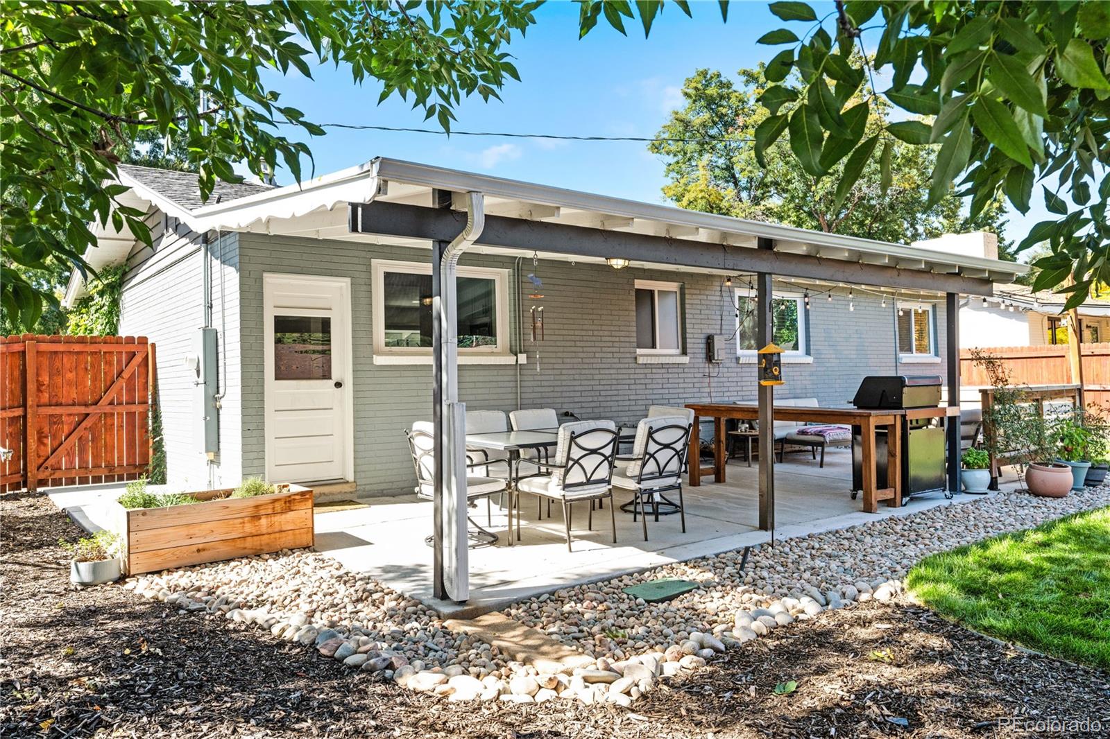 6000 Garrison Street Arvada, CO 80004 - Photo 32 of 50 a view of a house with backyard and sitting area