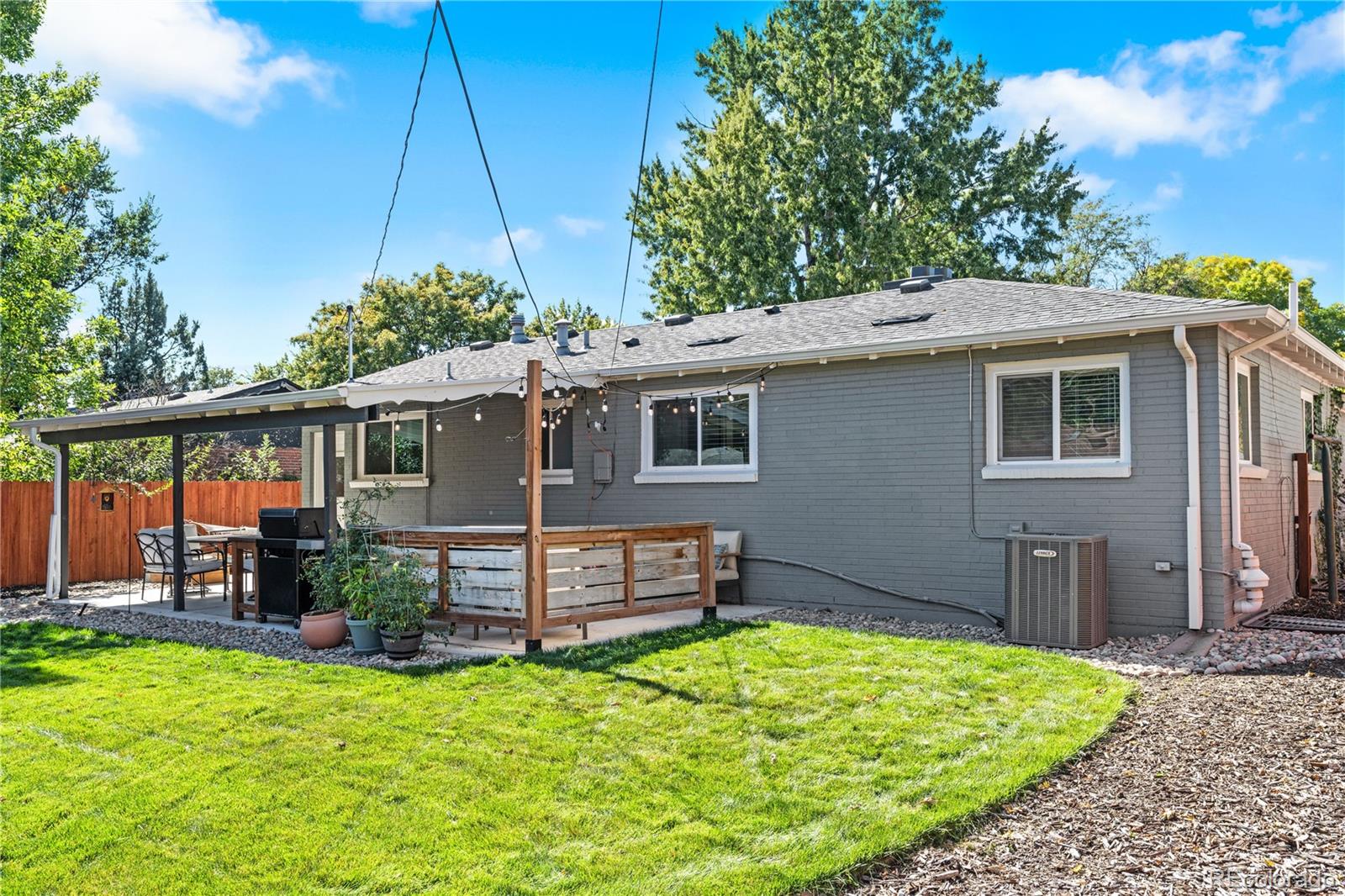 6000 Garrison Street Arvada, CO 80004 - Photo 35 of 50 front view of a house with a yard