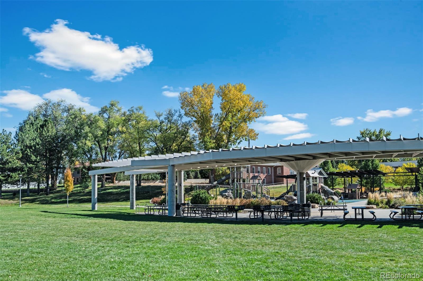 6000 Garrison Street Arvada, CO 80004 - Photo 44 of 50 a front view of house with yard and outdoor seating