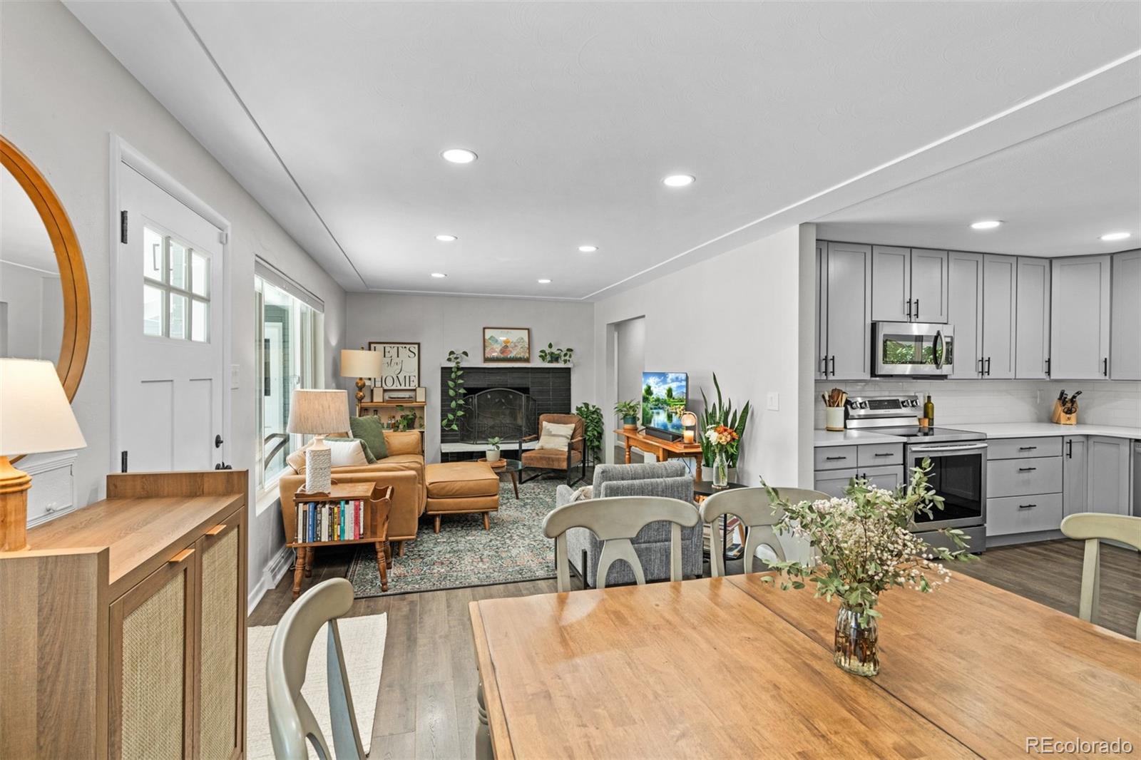 6000 Garrison Street Arvada, CO 80004 - Photo 10 of 50 a living room with furniture kitchen view and a large window