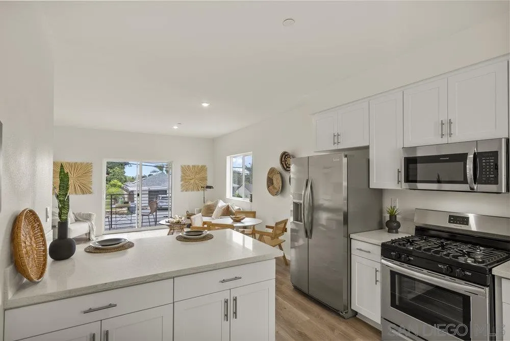 8184 Golden Avenue Lemon Grove, CA 91945 - Photo 13 of 48 a kitchen with stainless steel appliances a refrigerator stove and sink