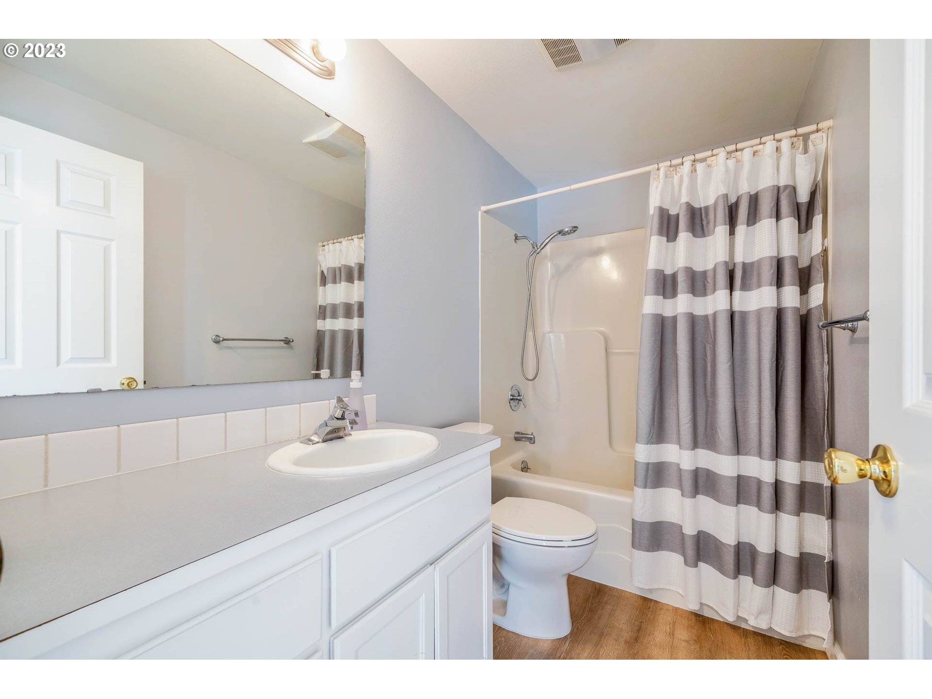 3595 Arbor Avenue Eugene, OR 97402 - Photo 12 of 26 a bathroom with a sink toilet a shower and a mirror