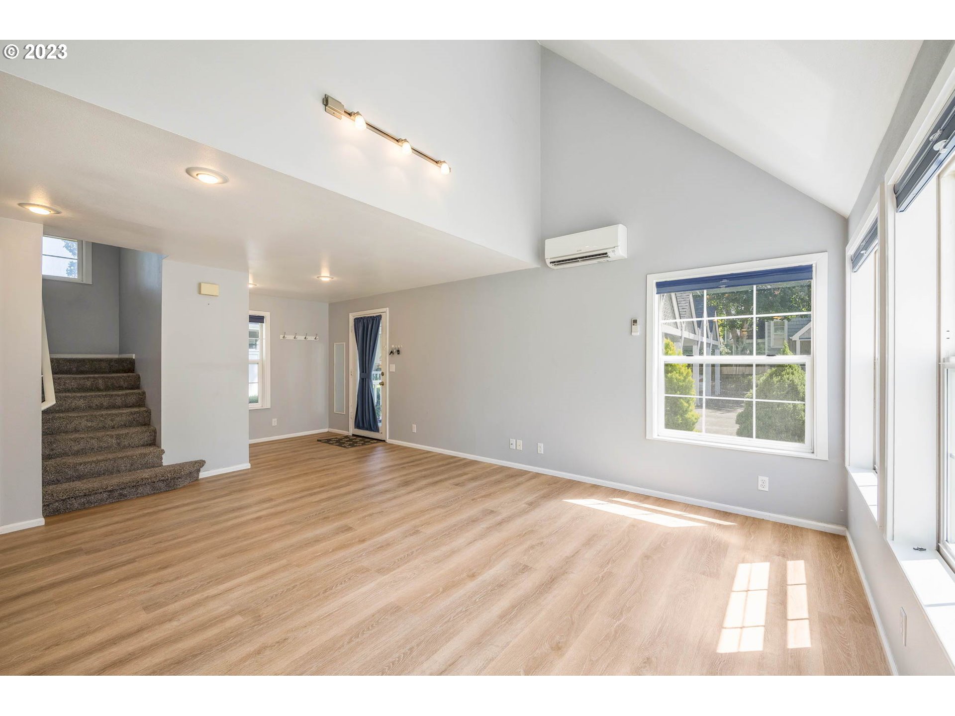 3595 Arbor Avenue Eugene, OR 97402 - Photo 3 of 26 a view of an empty room with wooden floor and a window
