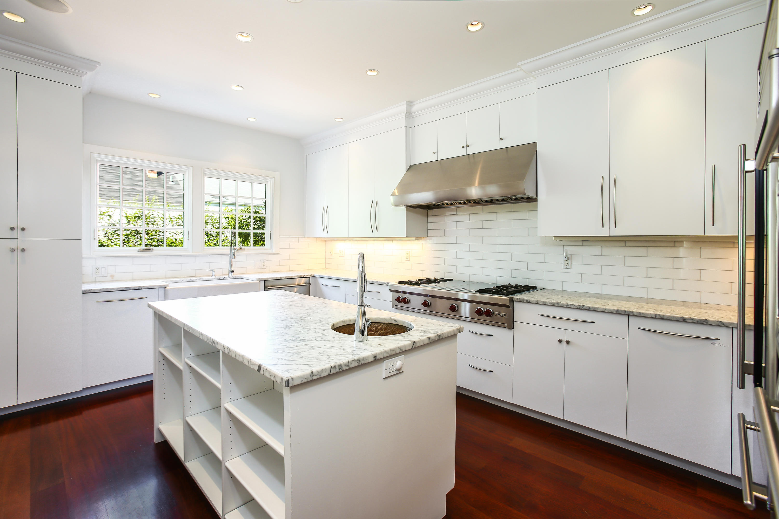 7 Sunwich Road Rowayton, CT 06853 - Photo 11 of 33 a kitchen with granite countertop stainless steel appliances a sink stove and cabinets