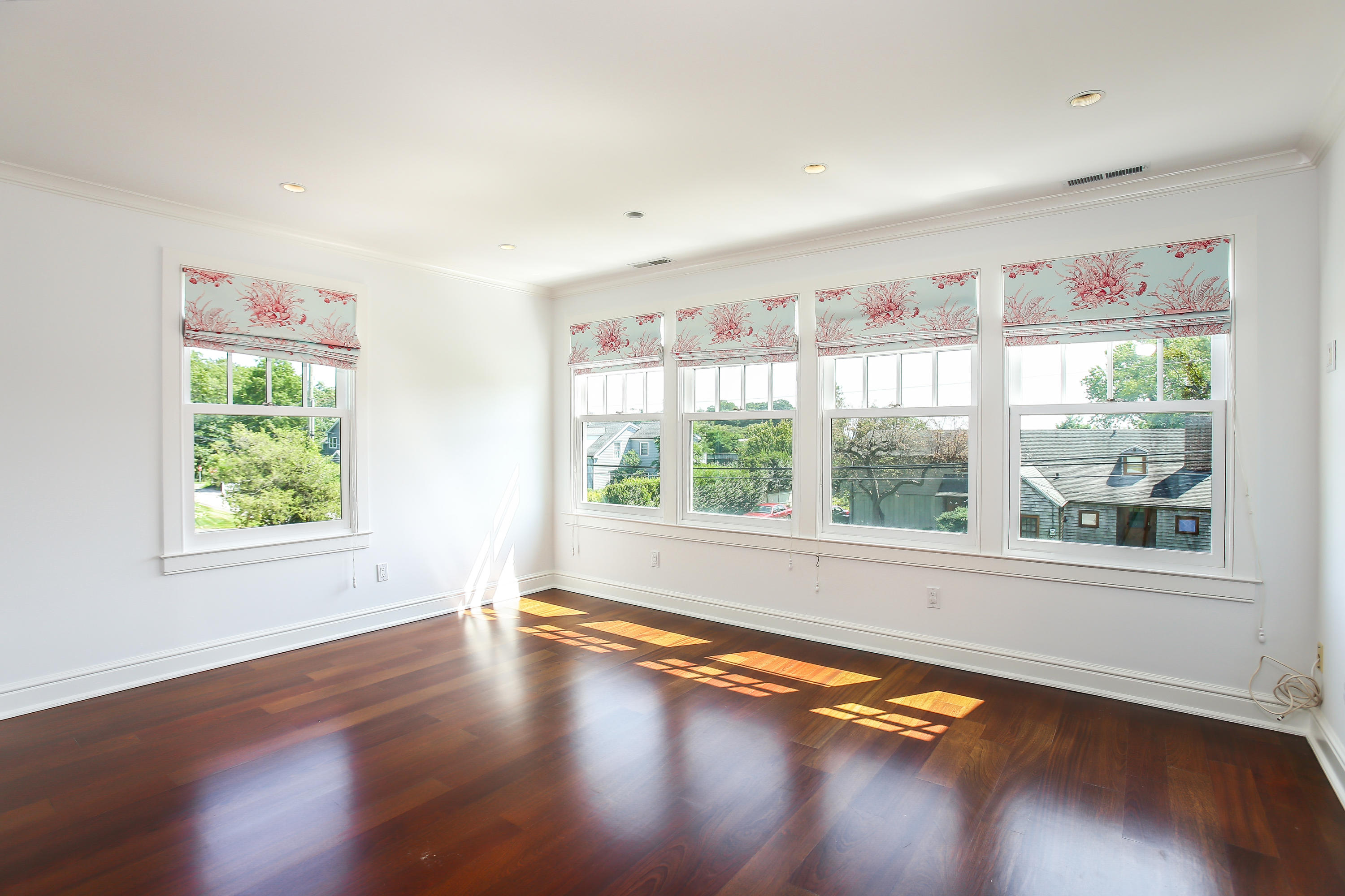 7 Sunwich Road Rowayton, CT 06853 - Photo 16 of 33 a view of empty room with wooden floor and fan
