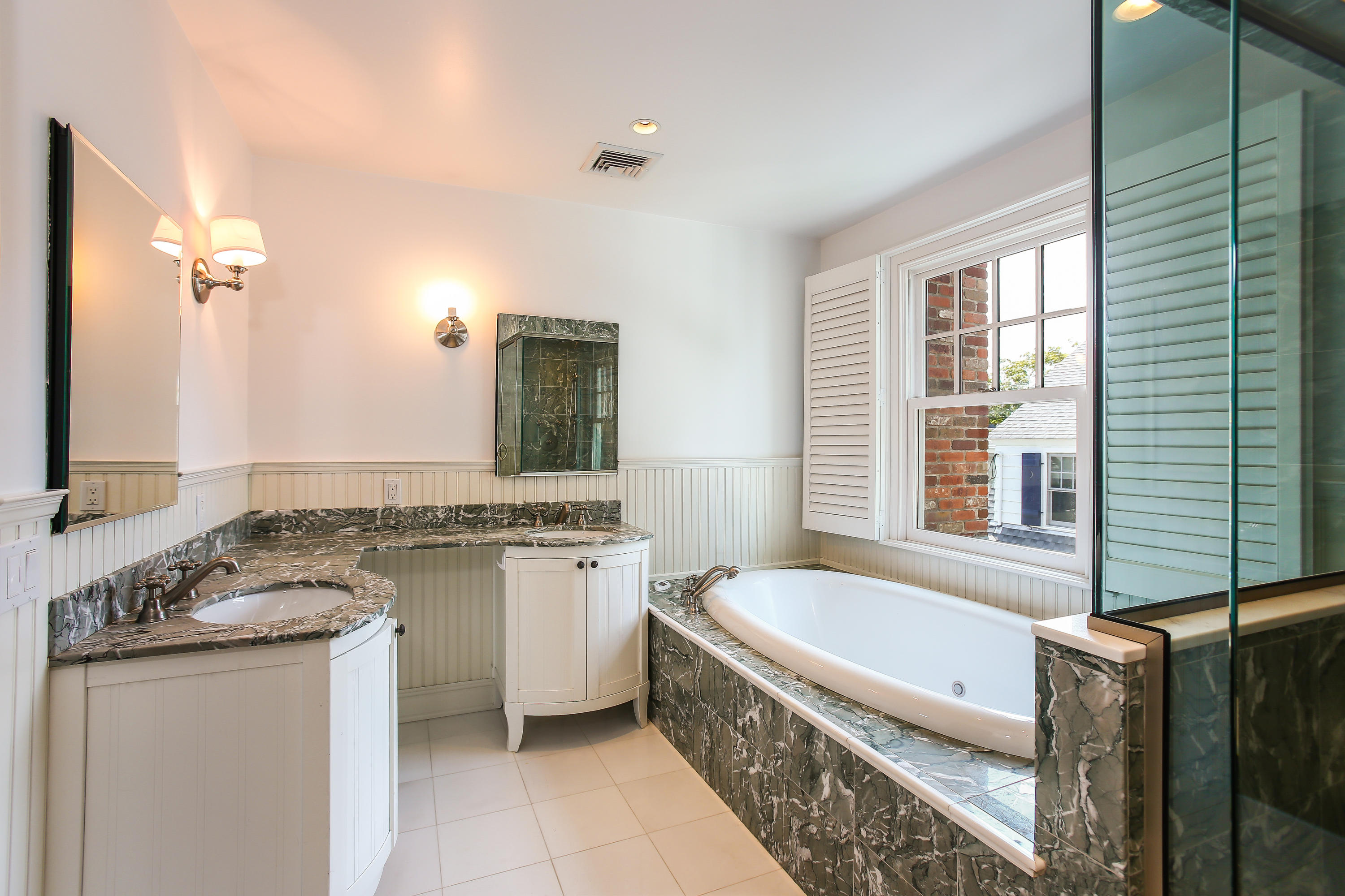 7 Sunwich Road Rowayton, CT 06853 - Photo 17 of 33 a bathroom with a granite countertop tub sink and mirror
