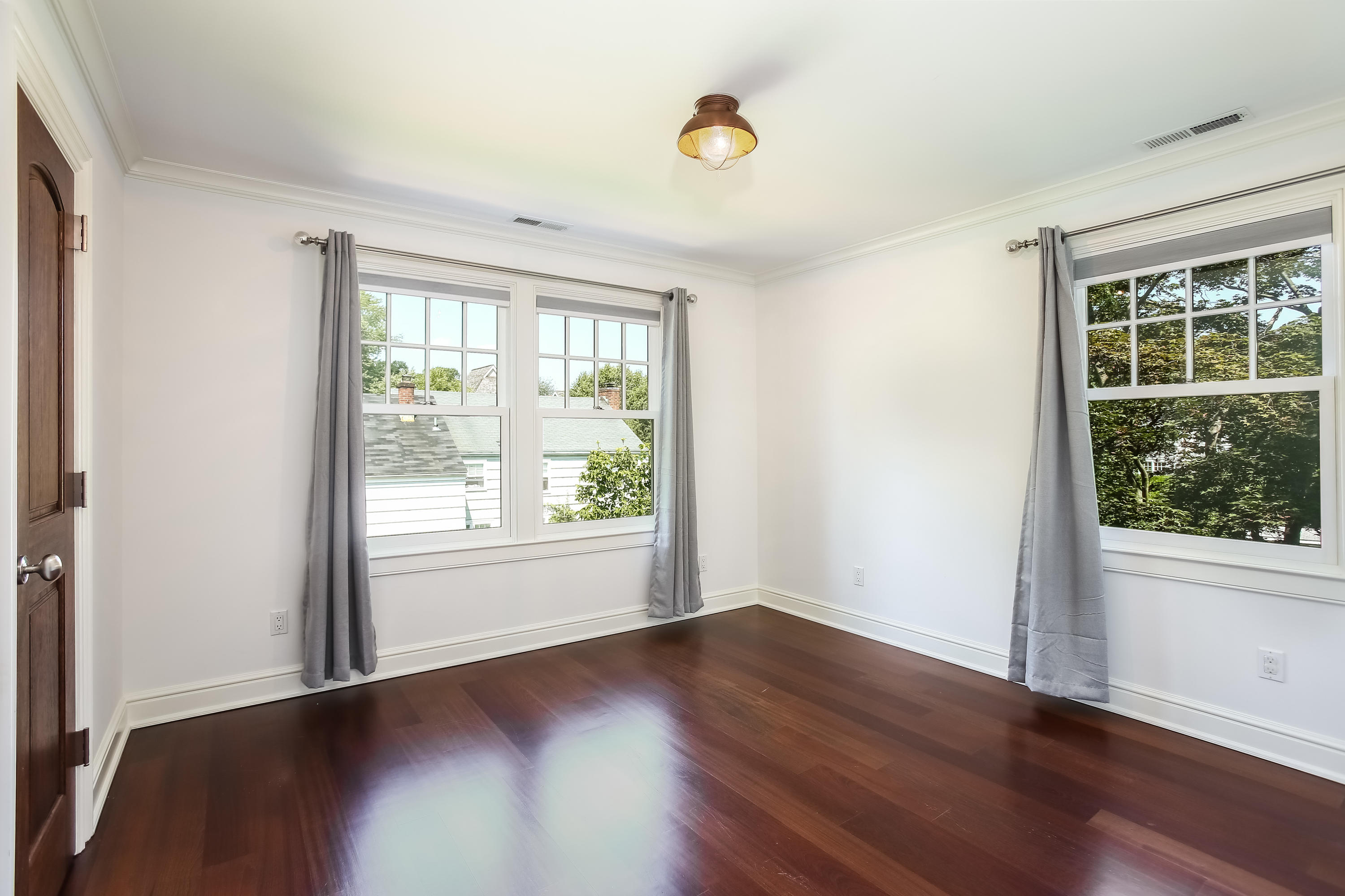 7 Sunwich Road Rowayton, CT 06853 - Photo 19 of 33 an empty room with wooden floor and windows