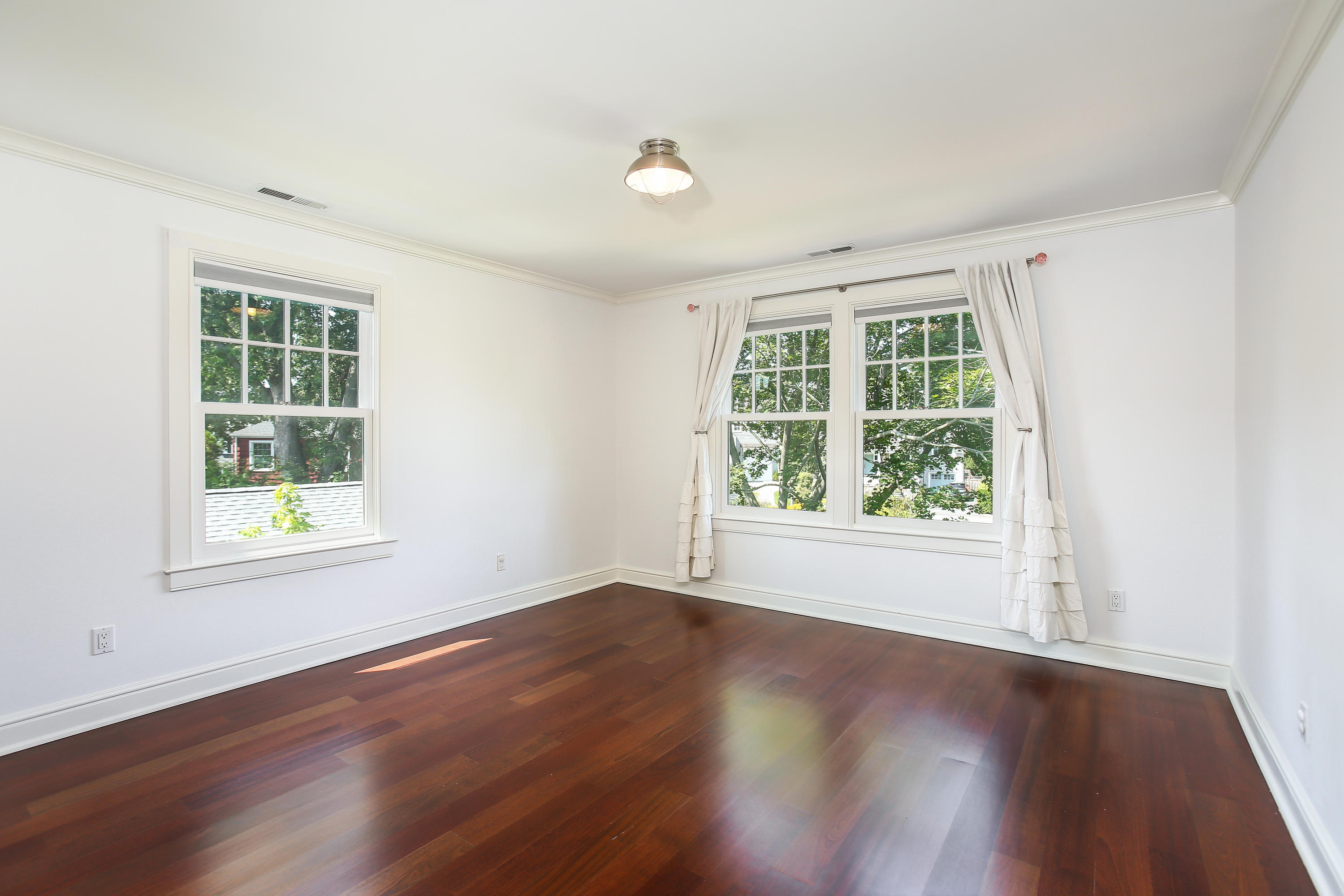 7 Sunwich Road Rowayton, CT 06853 - Photo 20 of 33 an empty room with wooden floor and windows