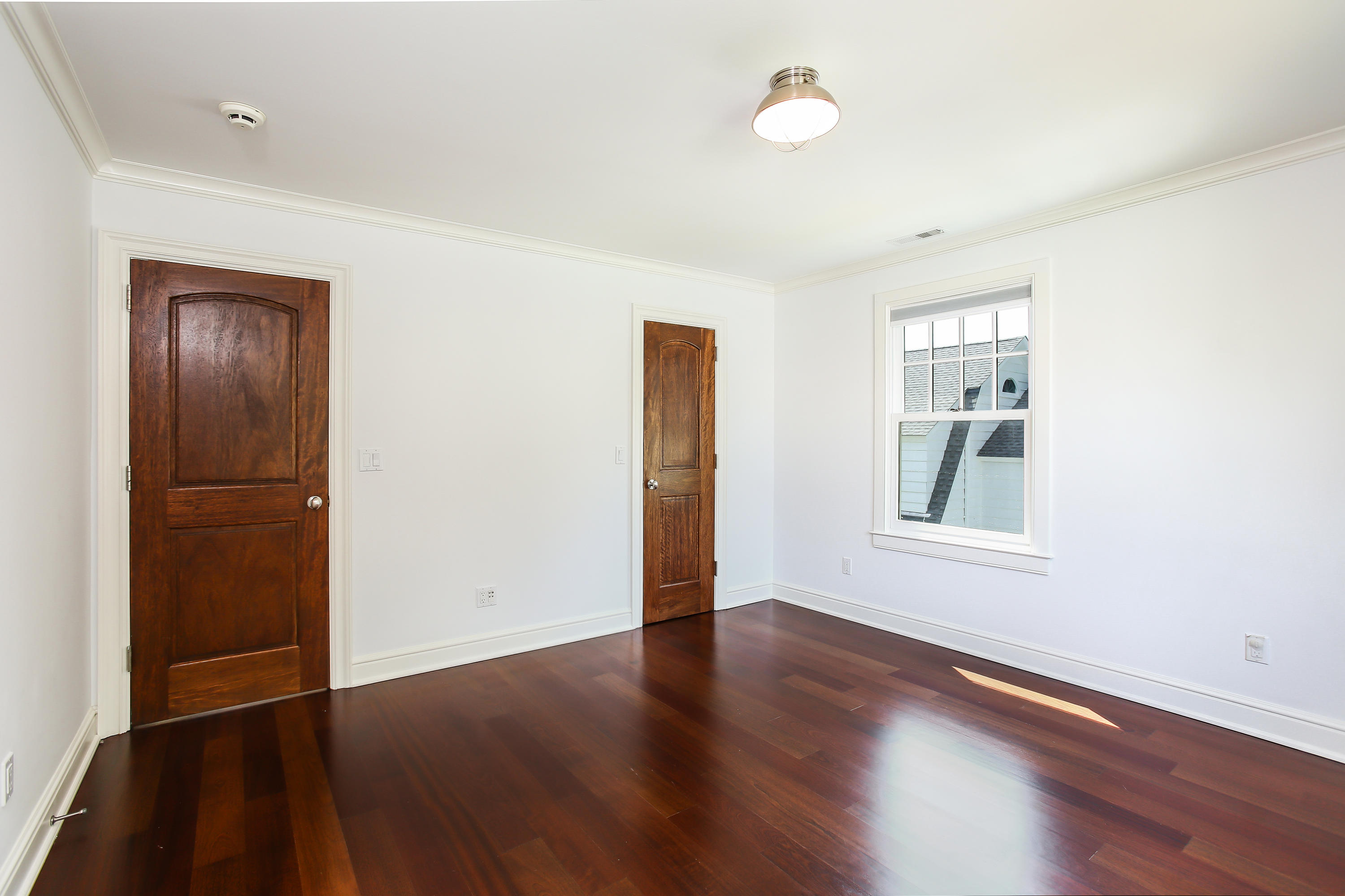 7 Sunwich Road Rowayton, CT 06853 - Photo 21 of 33 an empty room with wooden floor and windows