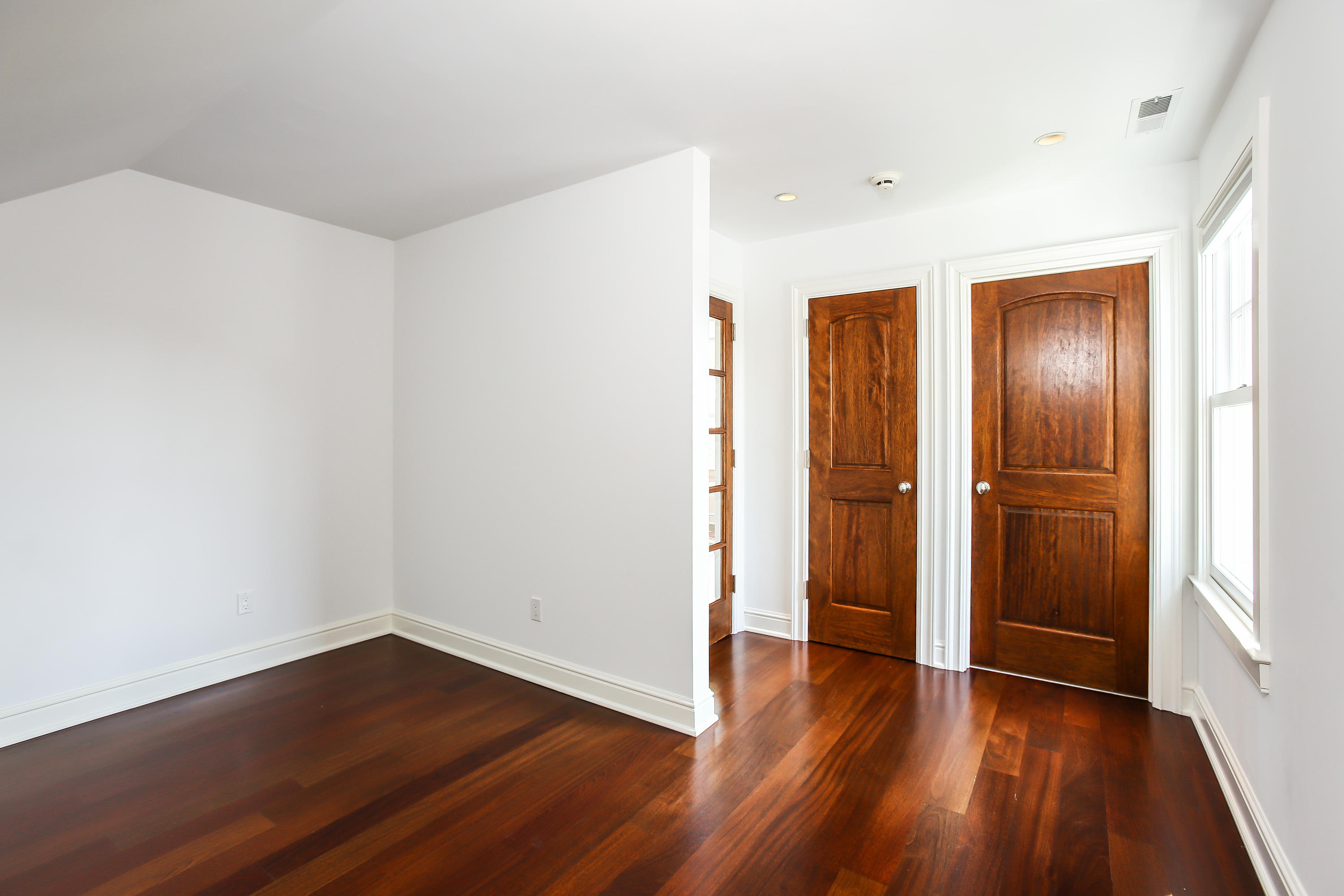 7 Sunwich Road Rowayton, CT 06853 - Photo 23 of 33 a view of an empty room with wooden floor and a window