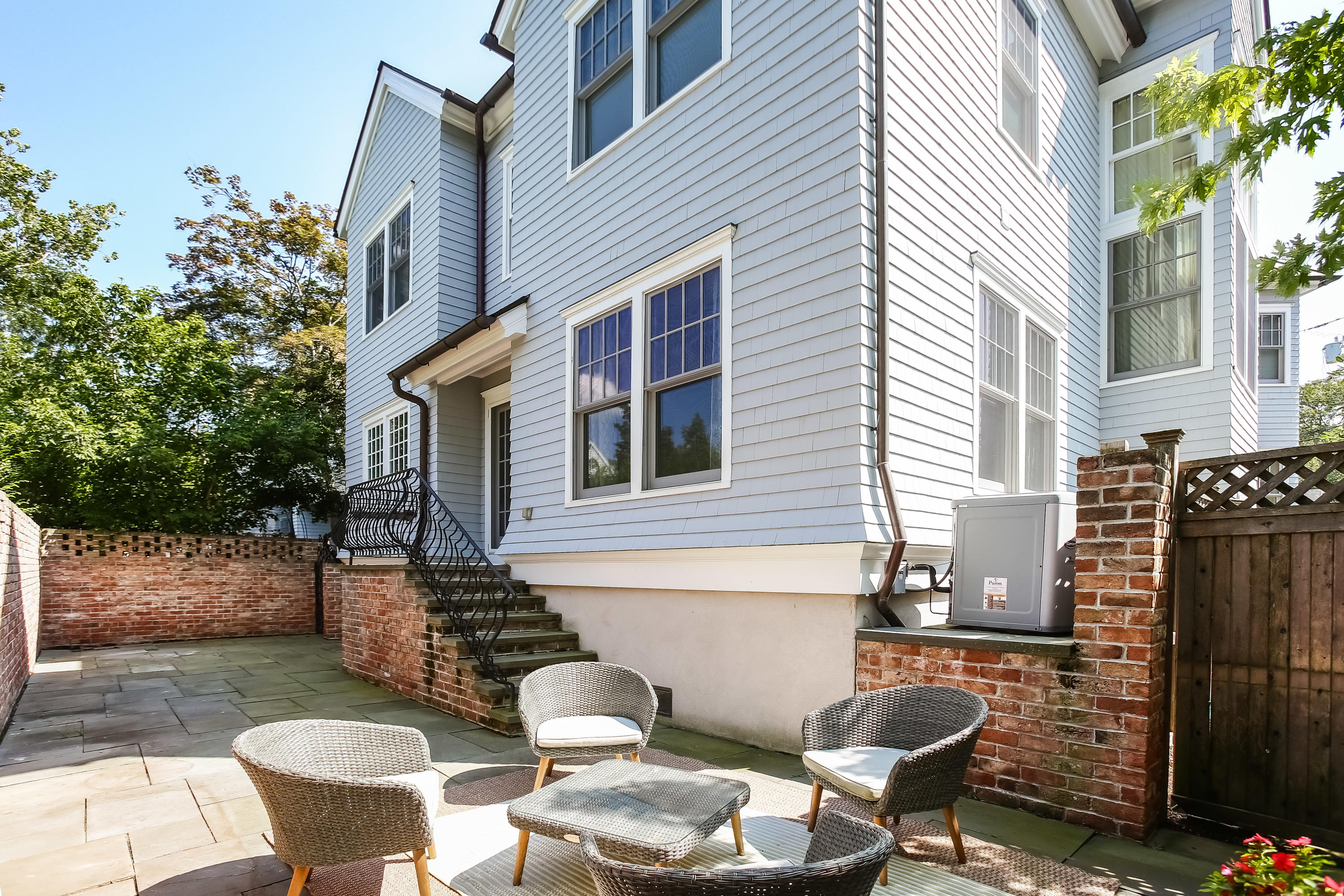 7 Sunwich Road Rowayton, CT 06853 - Photo 25 of 33 a view of a patio with couple of chairs and a fire pit