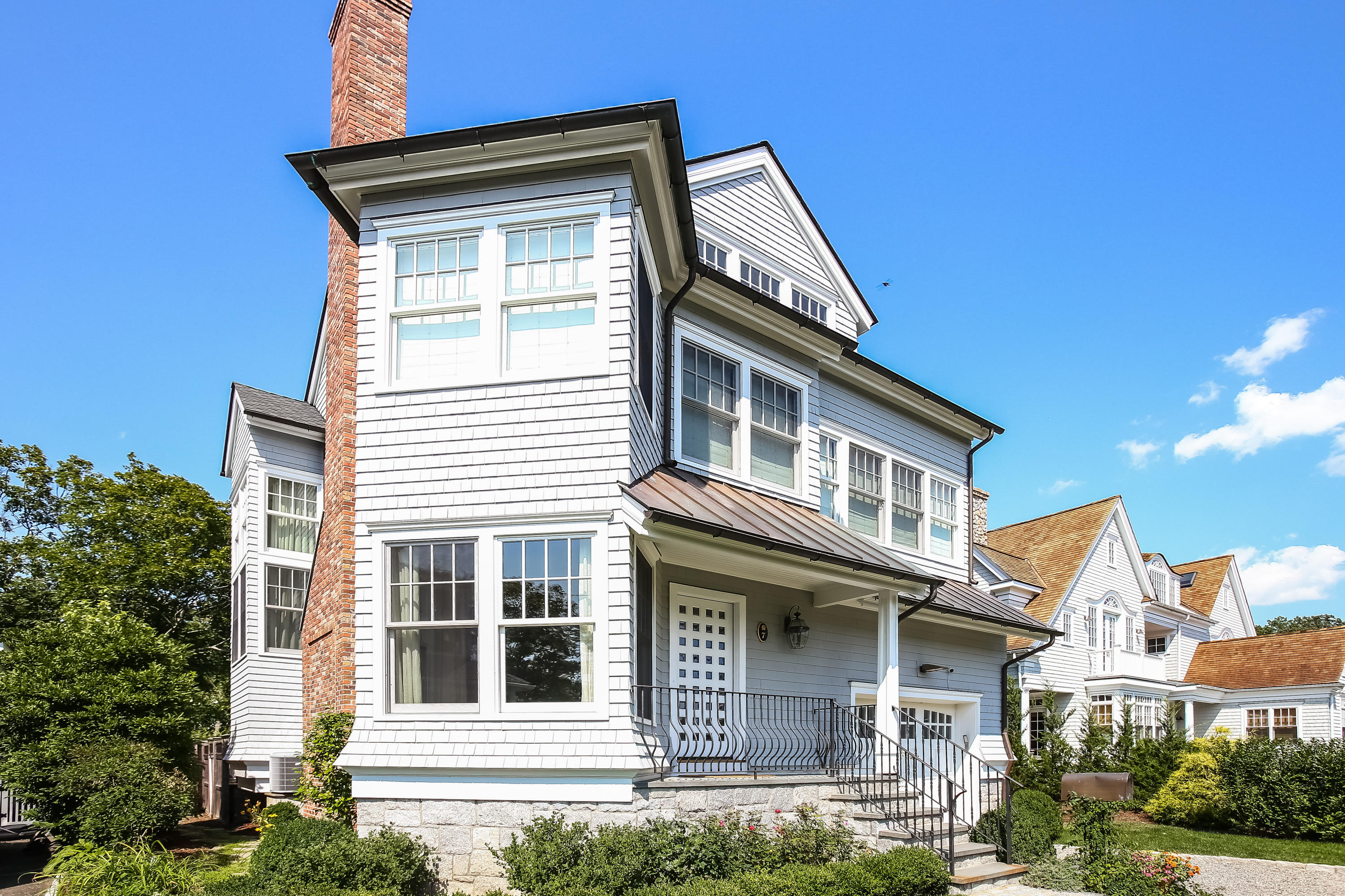 7 Sunwich Road Rowayton, CT 06853 - Photo 4 of 33 a front view of a house with garage