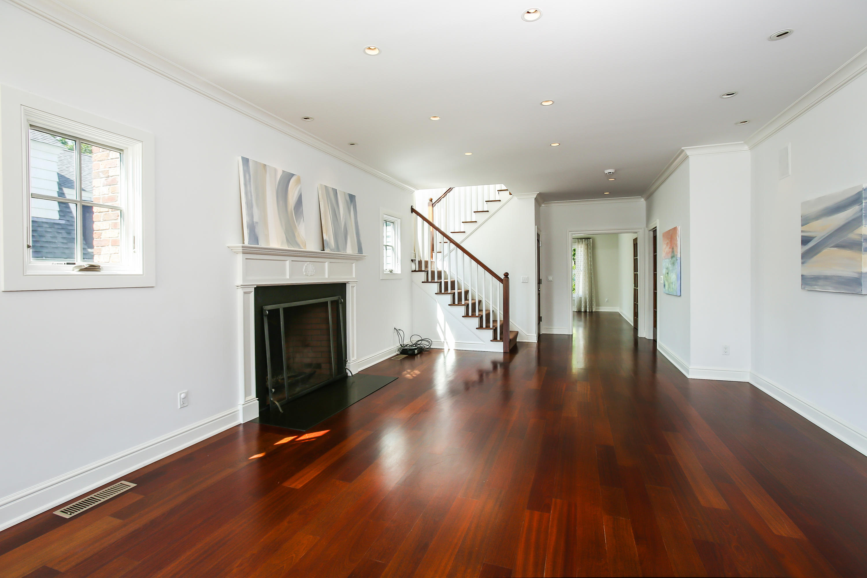 7 Sunwich Road Rowayton, CT 06853 - Photo 7 of 33 a view of empty room with wooden floor and fireplace