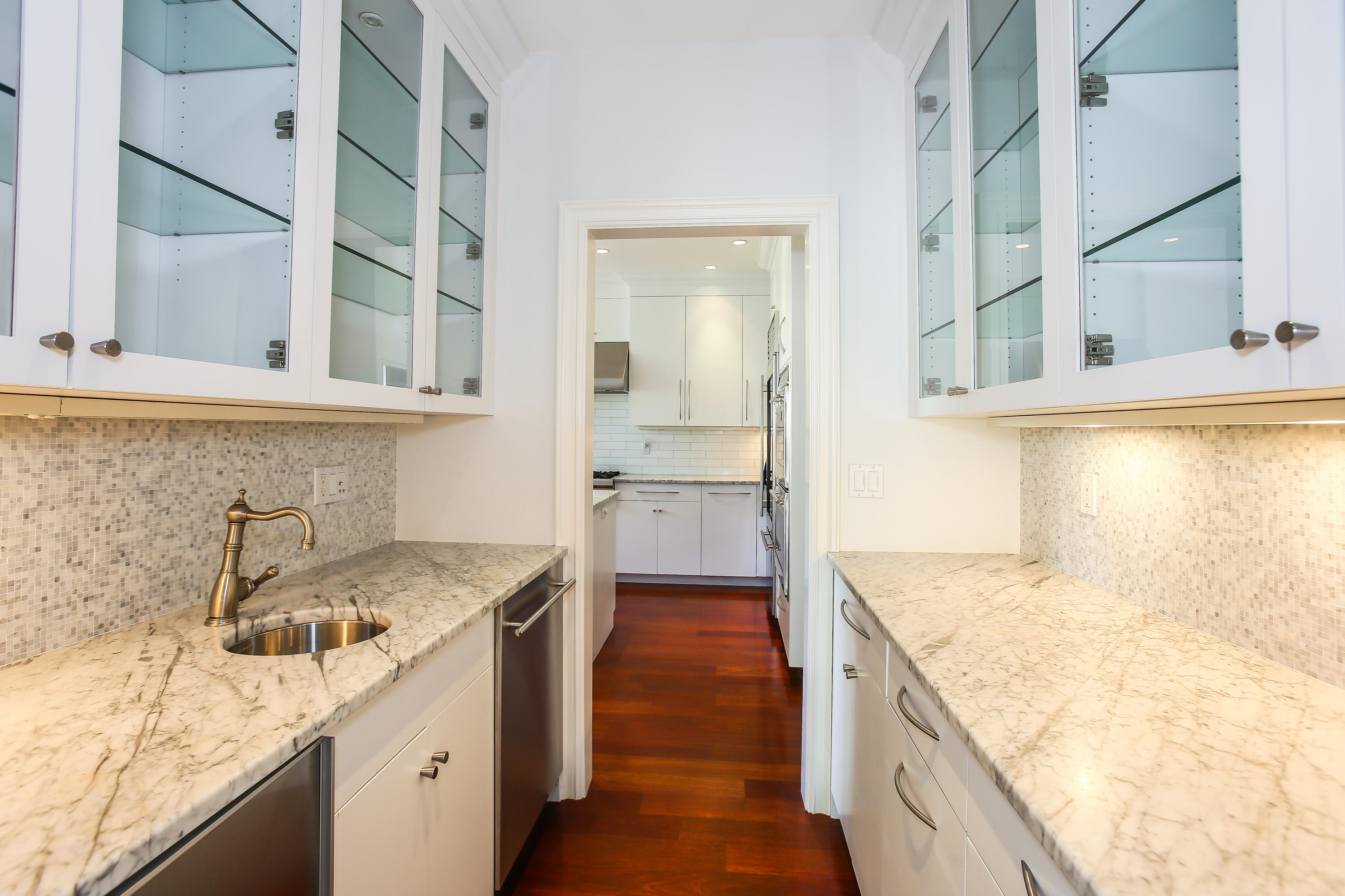 7 Sunwich Road Rowayton, CT 06853 - Photo 10 of 33 a kitchen with a sink stove and cabinets