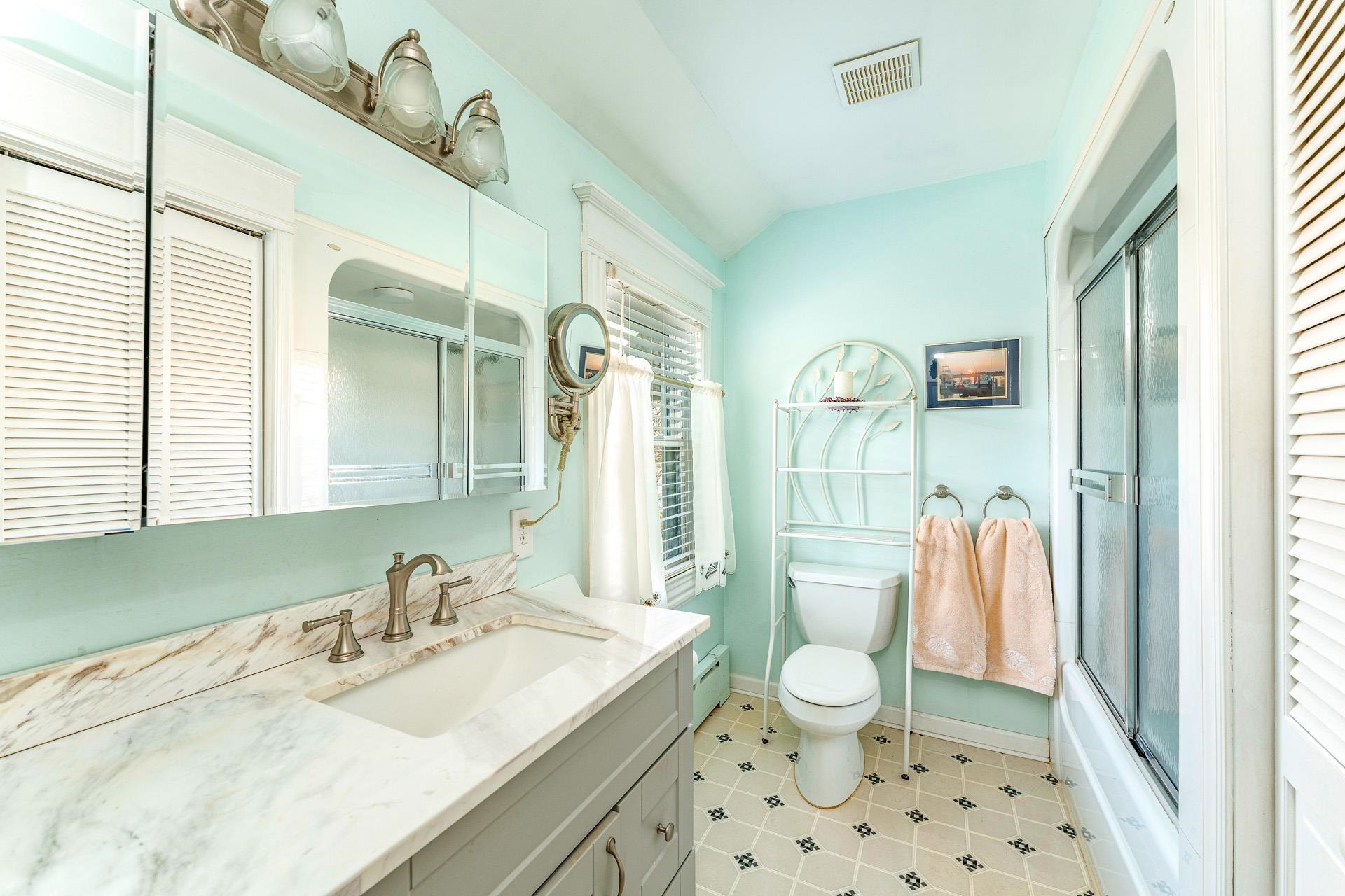 825 Bay Somers Point, NJ 08244 - Photo 15 of 41 a bathroom with a sink a toilet and shower