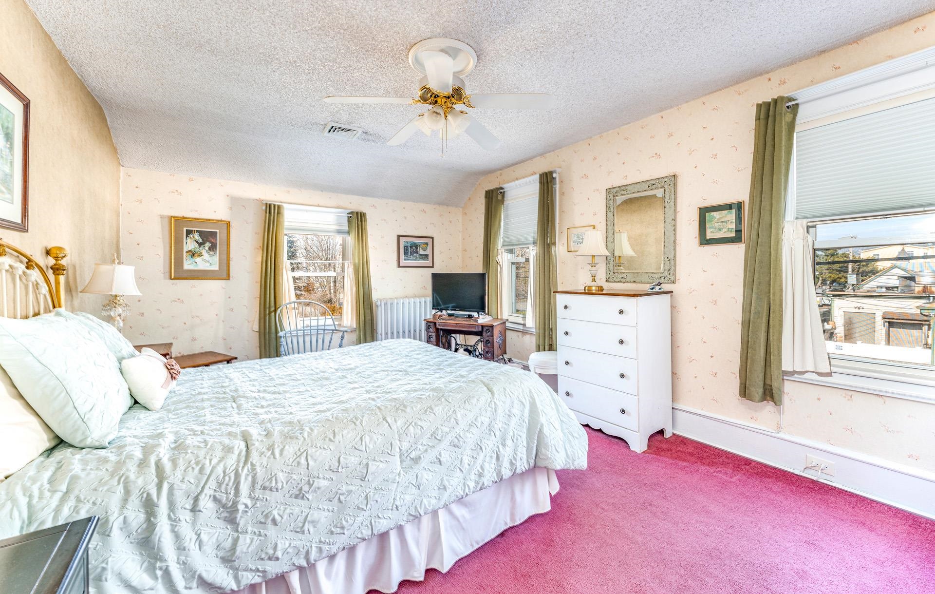 825 Bay Somers Point, NJ 08244 - Photo 18 of 41 a bedroom with a bed and a chandelier