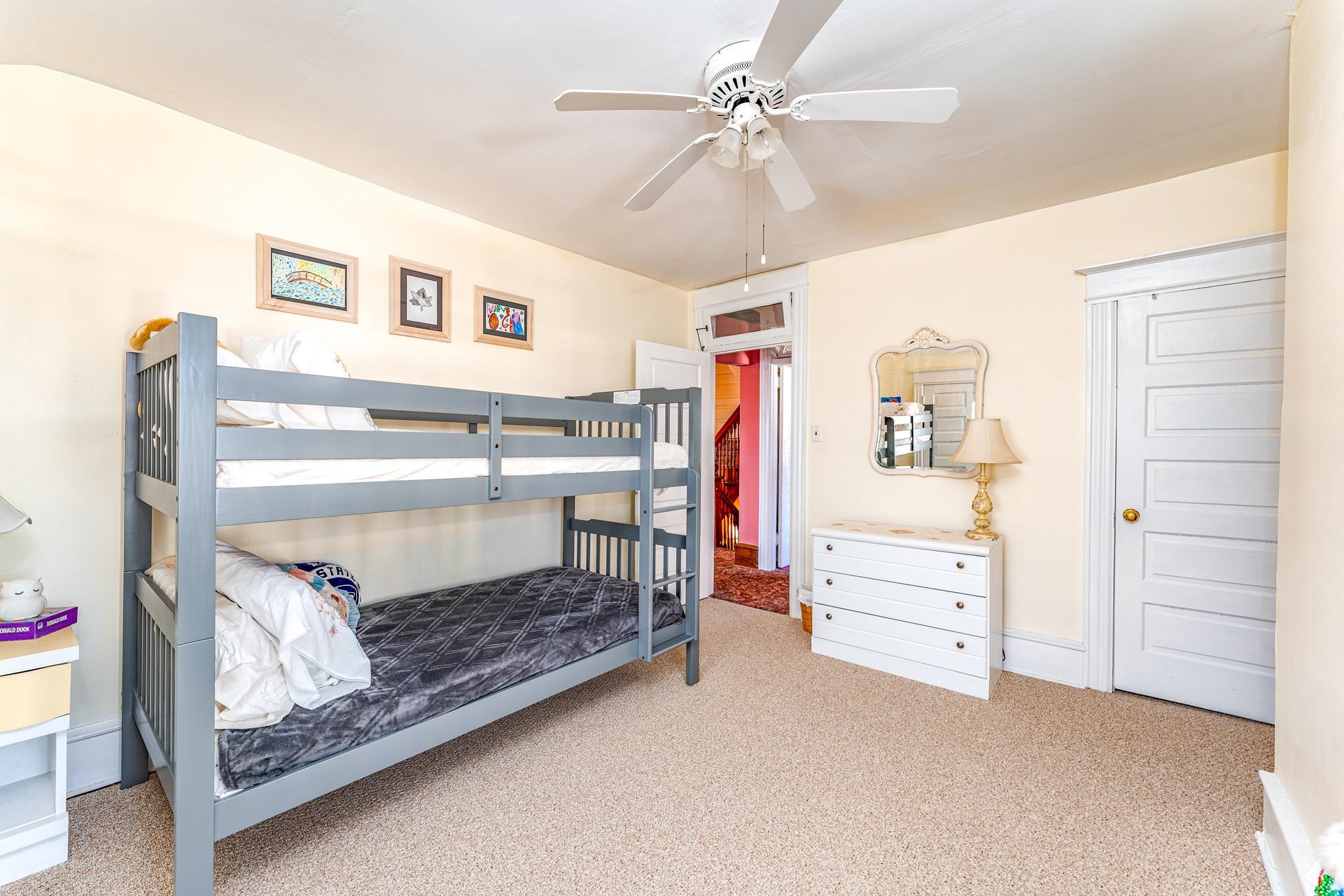 825 Bay Somers Point, NJ 08244 - Photo 19 of 41 a bedroom with a bed and a chandelier