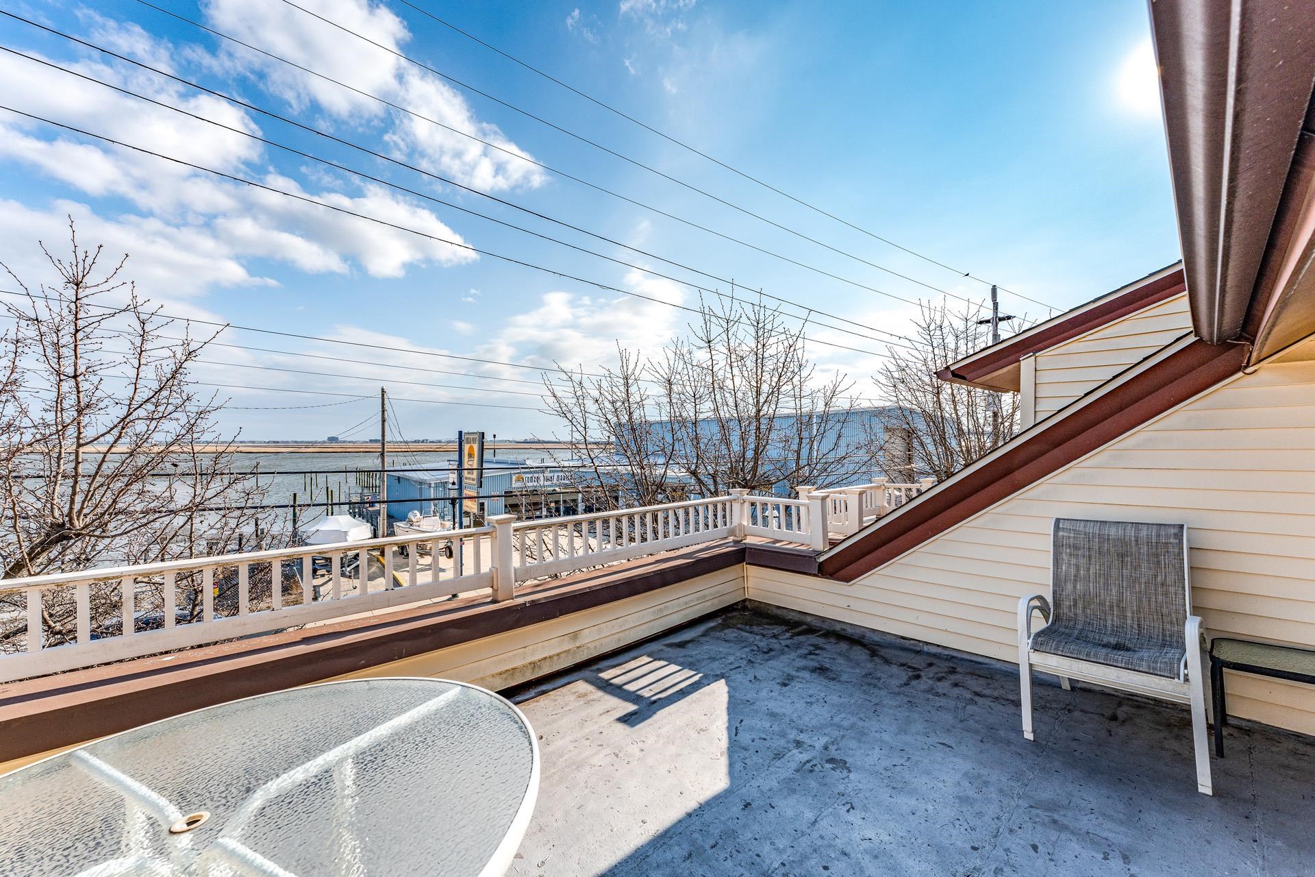 825 Bay Somers Point, NJ 08244 - Photo 23 of 41 a view of balcony with two chairs and a barbeque