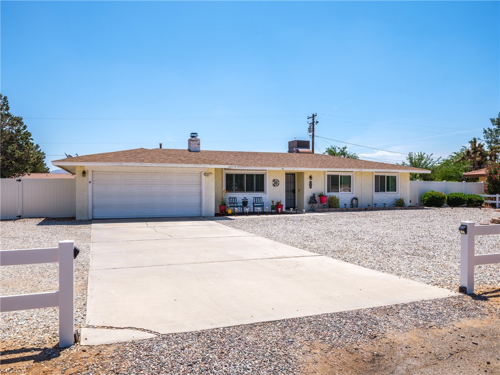 13979 Olathe Road Apple Valley, CA 92307 - Photo 1 of 1 a front view of house with a yard