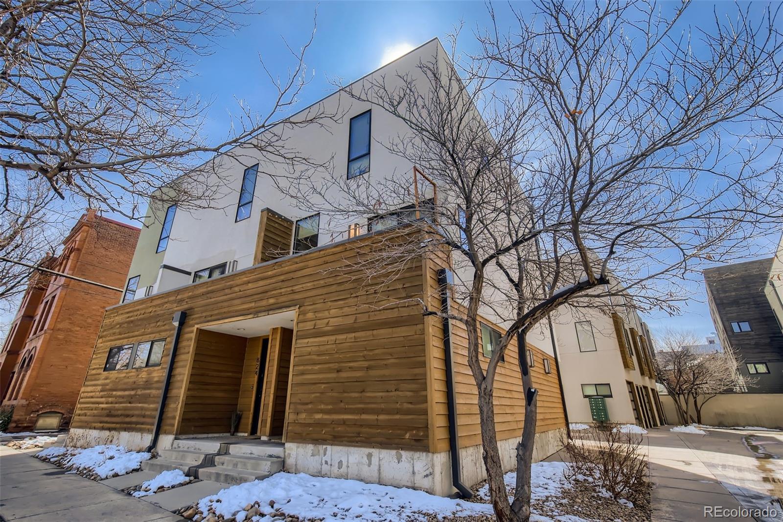 a front view of a house with parking space