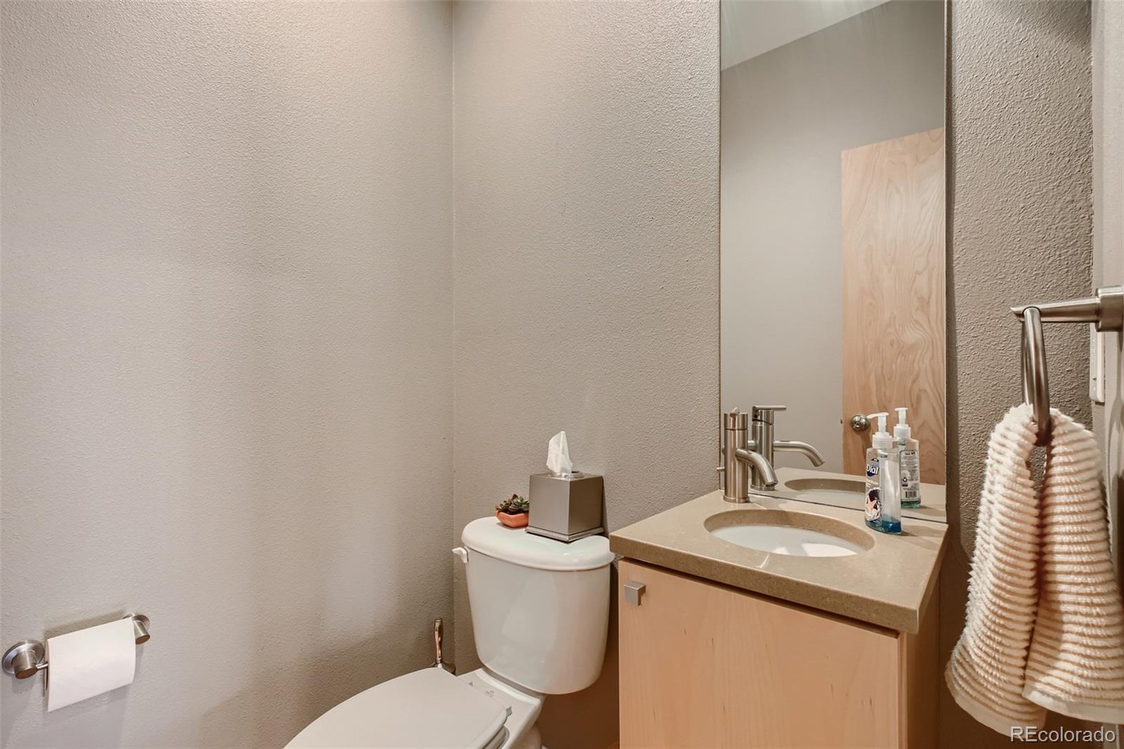 826 25th Street Denver, CO 80205 - Photo 12 of 23 a bathroom with a sink and a toilet