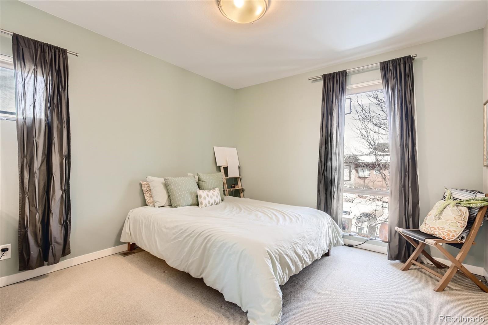 826 25th Street Denver, CO 80205 - Photo 13 of 23 a bedroom with a bed and a window
